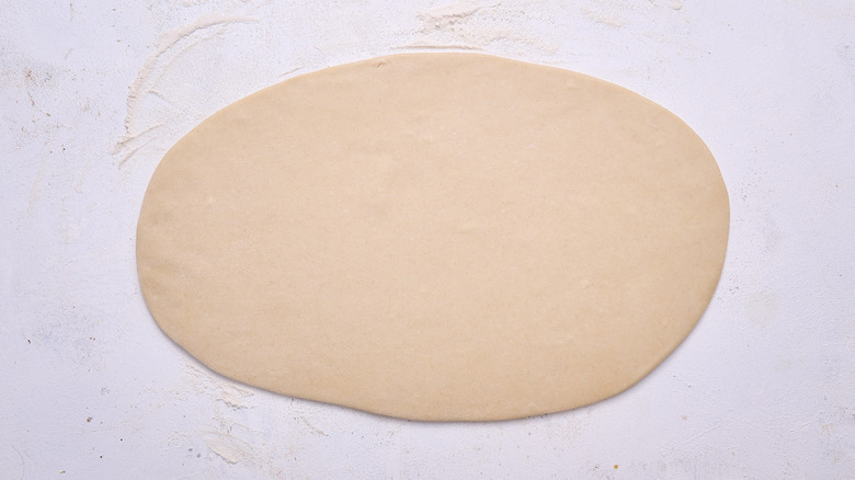 rolling dough into flatbread