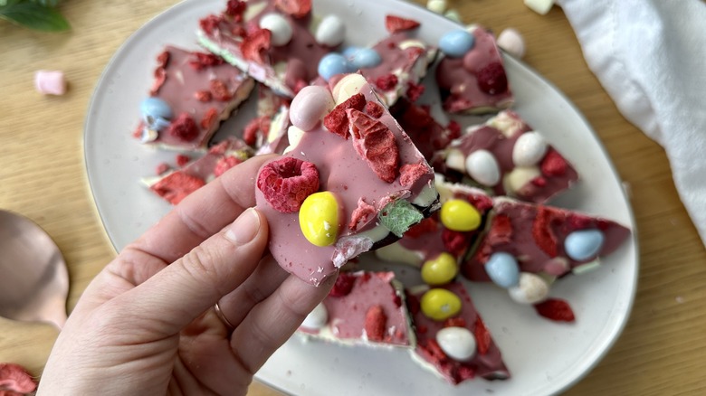 Holding triple-chocolate Easter marshmallow bark