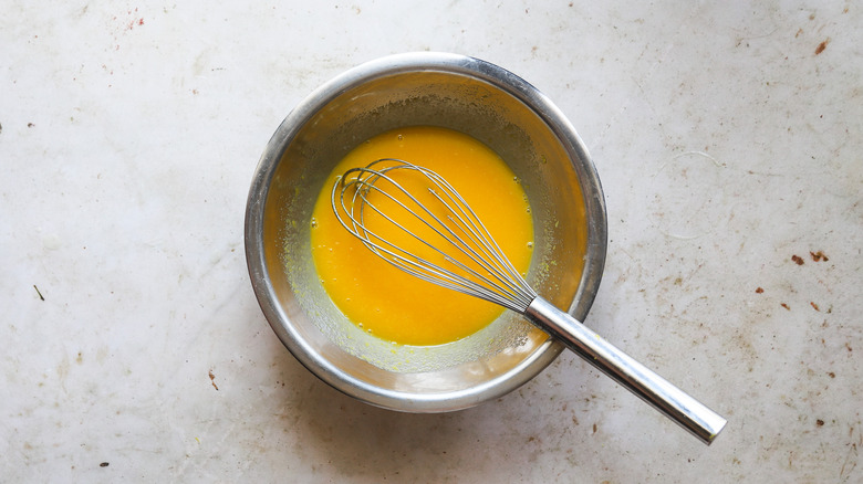 Bowl with lemon curd ingredients