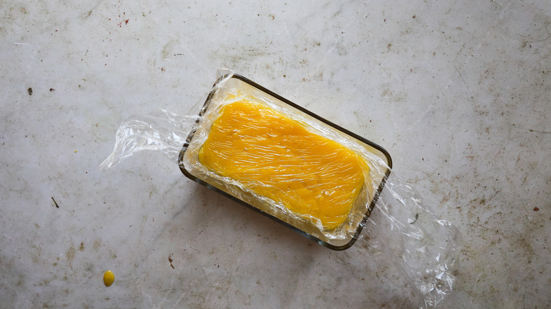 Lemon curd with plastic wrap