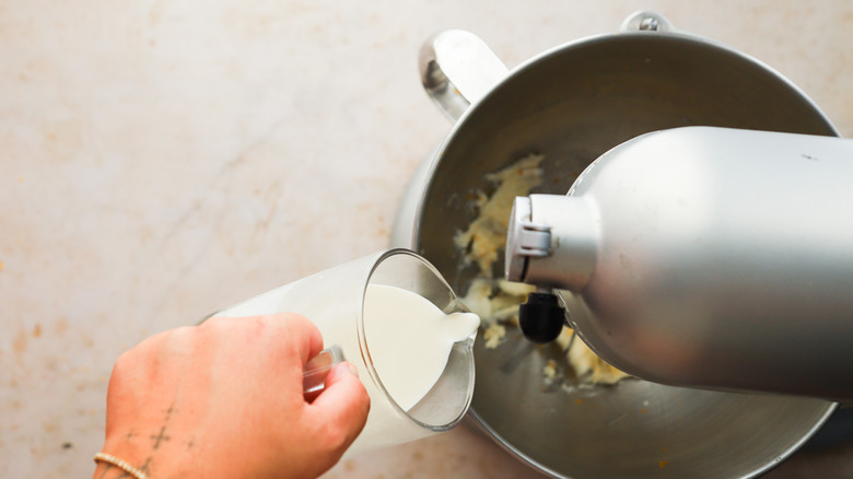 Adding cream to bowl