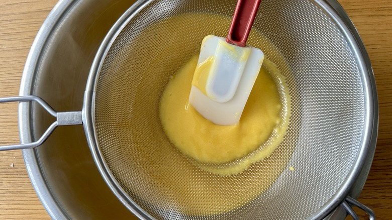 Straining passion fruit filling