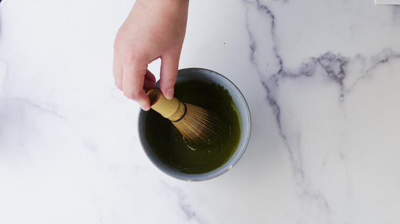 Whisking matcha in bowl