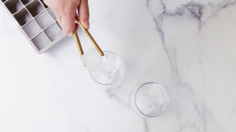 Adding ice to matcha glasses