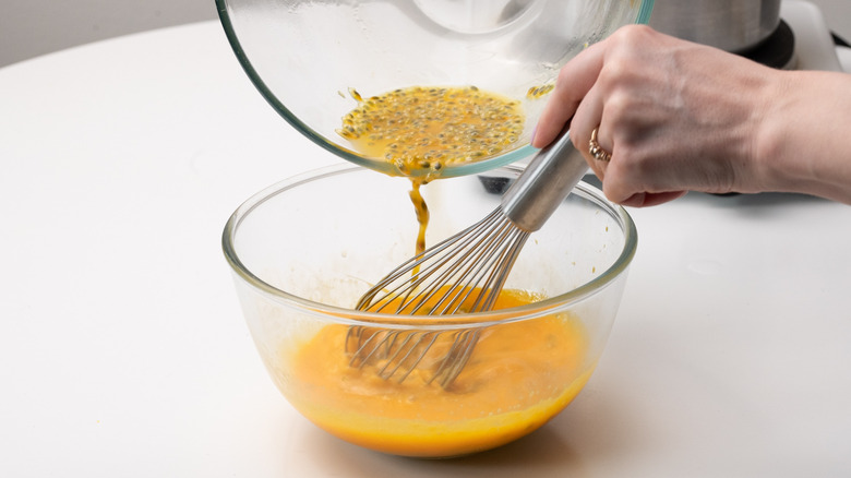 pouring passion fruit into bowl