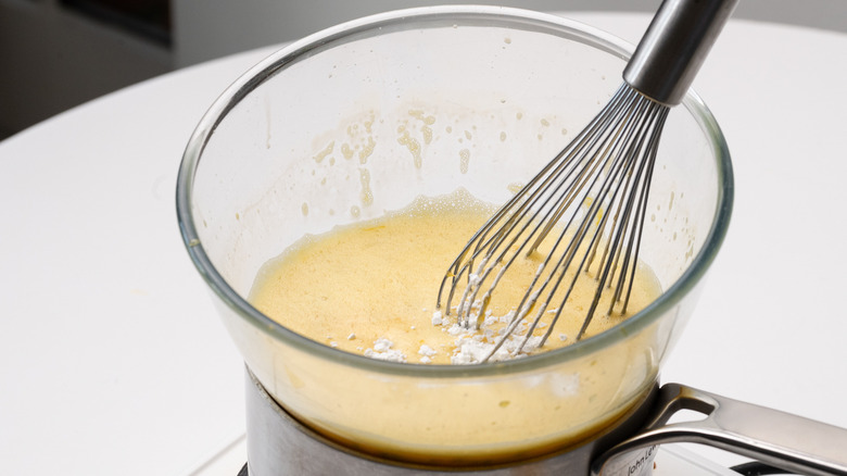 adding cornstarch to curd