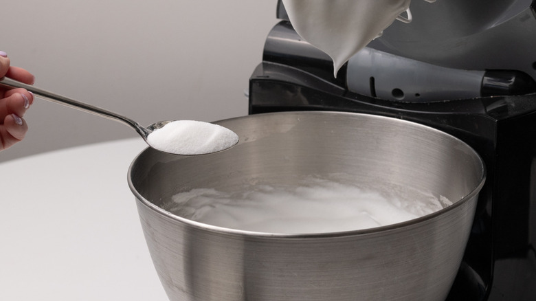 adding sugar to stand mixer