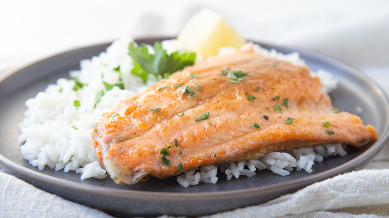 trout on plate with rice