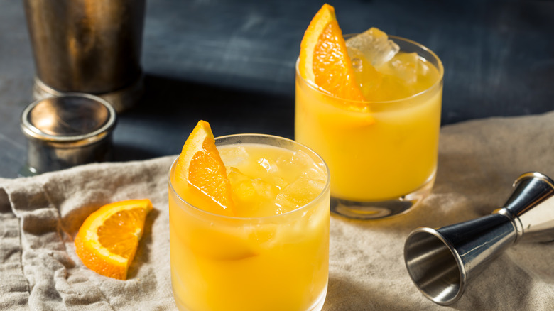 two screwdriver cocktails with oranges