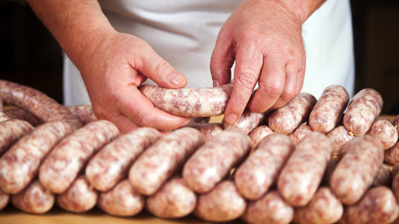 Preparing sausages by hand