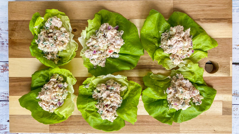 Tuna salad in lettuce wraps on cutting board
