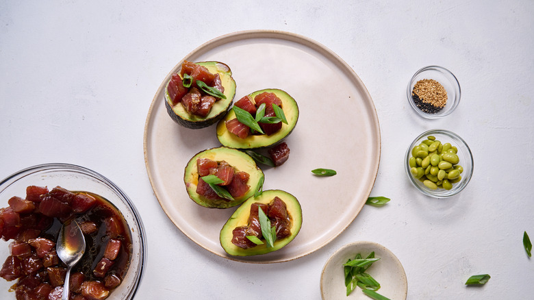 tuna stuffed avocados on plate