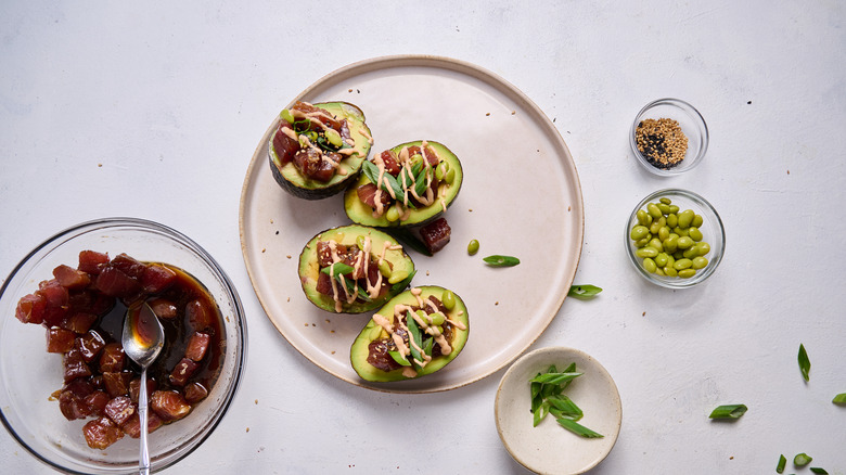 tuna poke stuffed avocados on plate