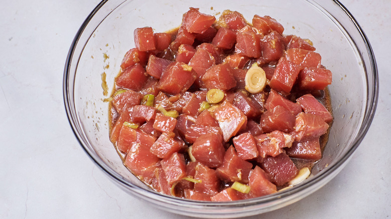 tuna marinating in bowl