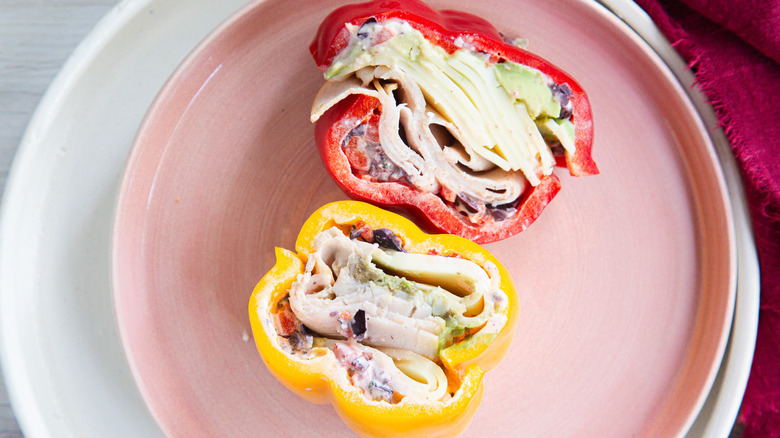 Two bell pepper sandwich halves on pink plate