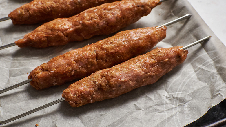 turkey skewers on baking sheet