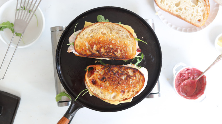 panini sandwiches cooking on a griddle