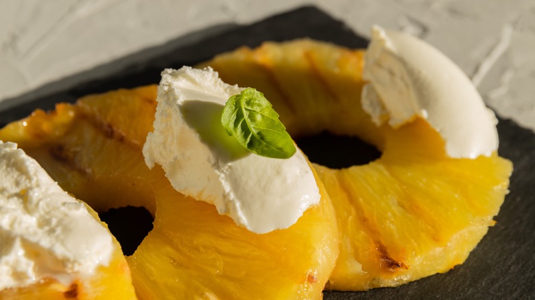 cooked pineapple rings with ice cream