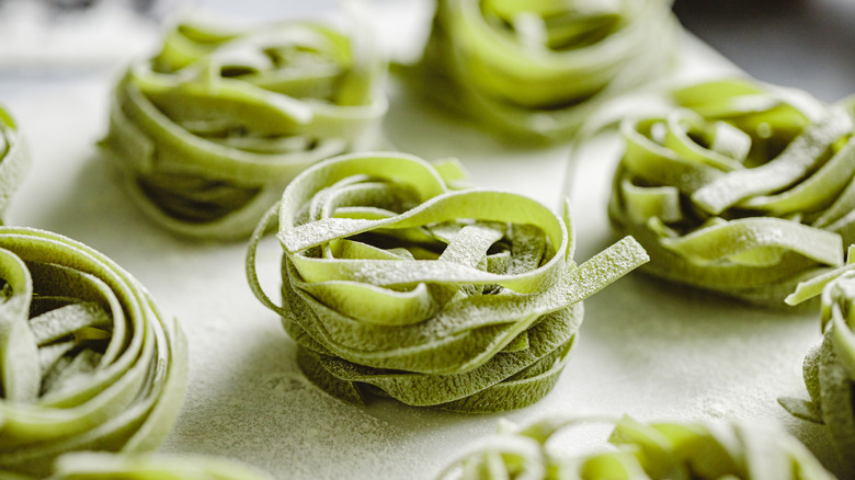 Uncooked fettucine spinach pasta