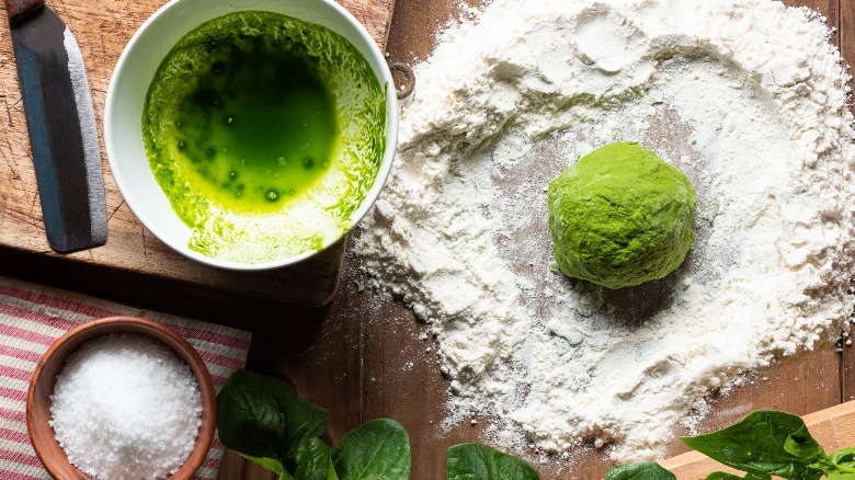 Spinach, flour, and a green dough ball