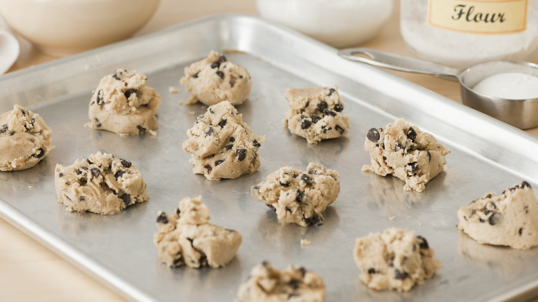 cookie dough balls on a sheet pan