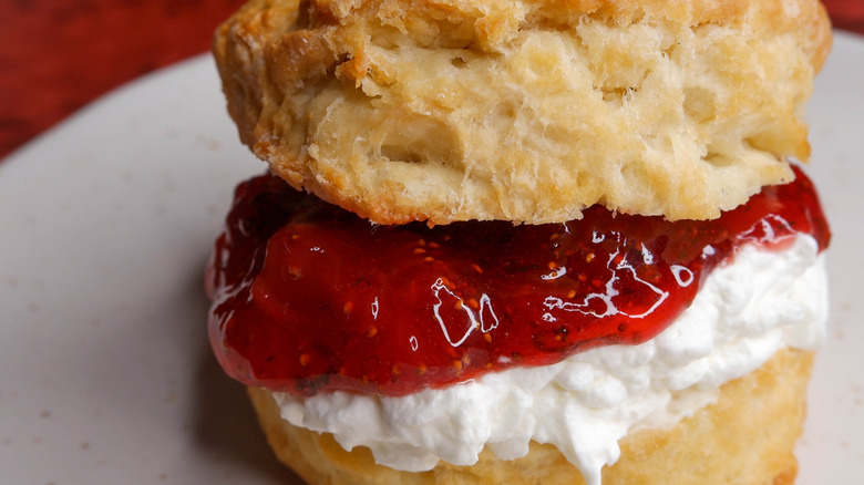 A close-up of finished strawberry shortcake made with biscuits