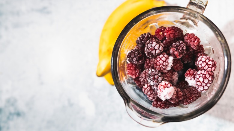 frozen raspberries in glass cup