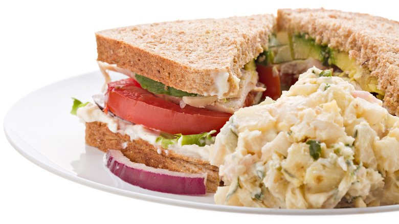 Sandwich plated with potato salad