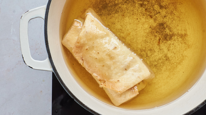 Chimichanga frying in oil 