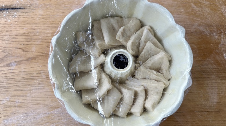 Dough covered to rise in pan