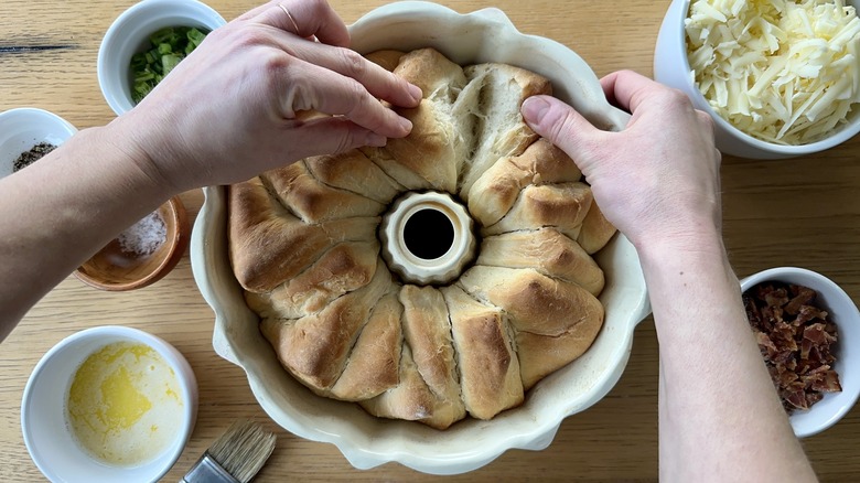 Pulling apart bread loaf