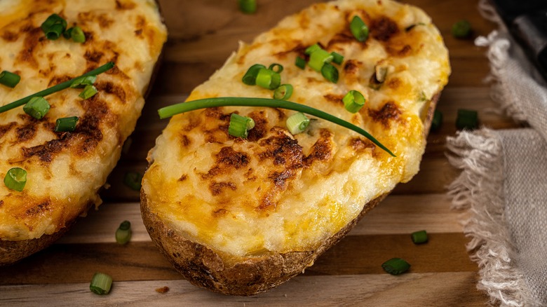 Twice-baked potato garnished with scallions