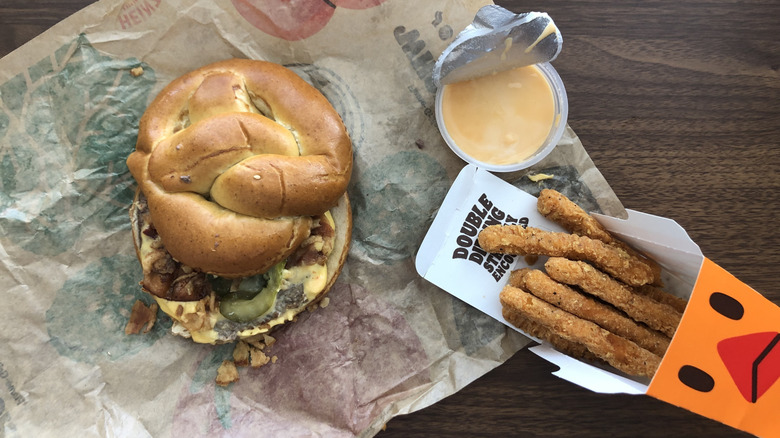 Burger King's Game Day Pretzel Whopper and chicken fries meal with nacho sauce