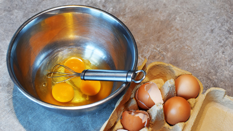 eggs in bowl with whisk