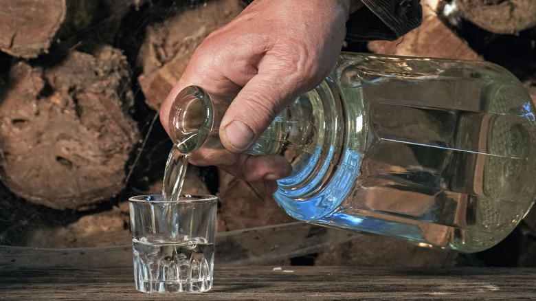 Pouring glass of Eau-De-Vie