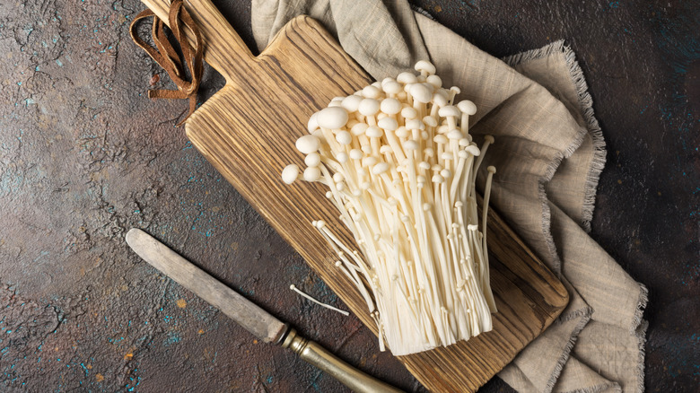 Enoki mushrooms wood cutting board