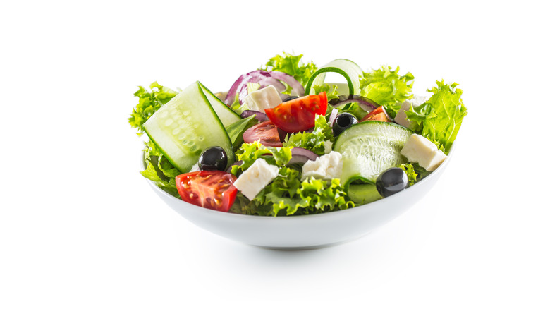 Small salad in white bowl