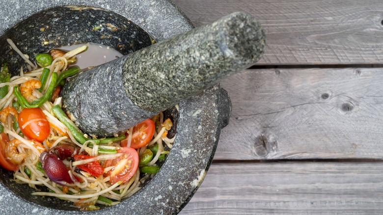 Thai salad, mortar, and pestle