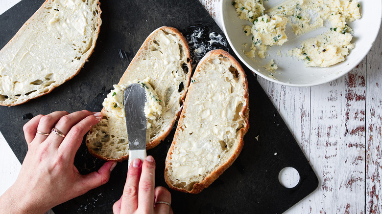 spreading cheese mixture on bread