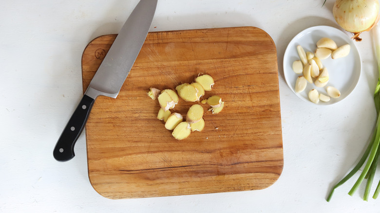 sliced ginger on cutting board