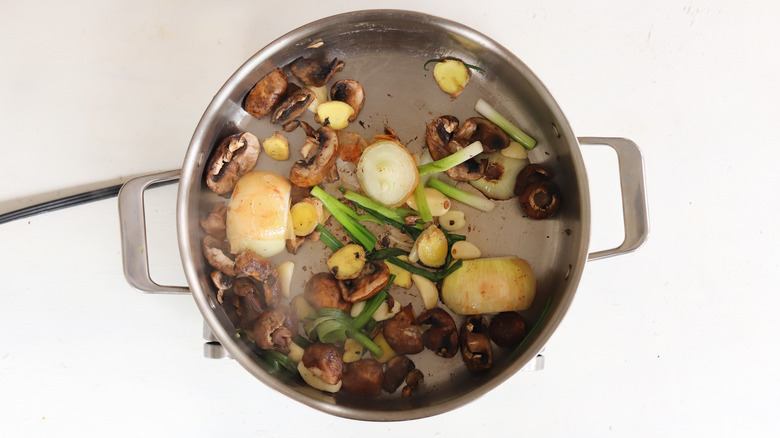 charred vegetables in pan