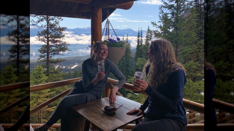 friends laugh on scenic patio