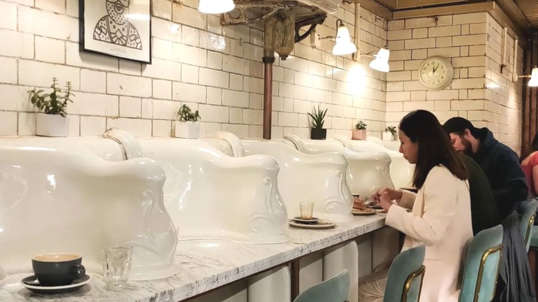 refurbished urinals become cafe seats