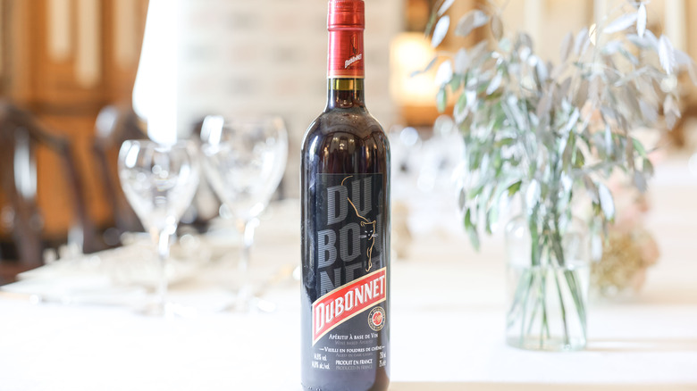 Bottle of Dubonnet on table