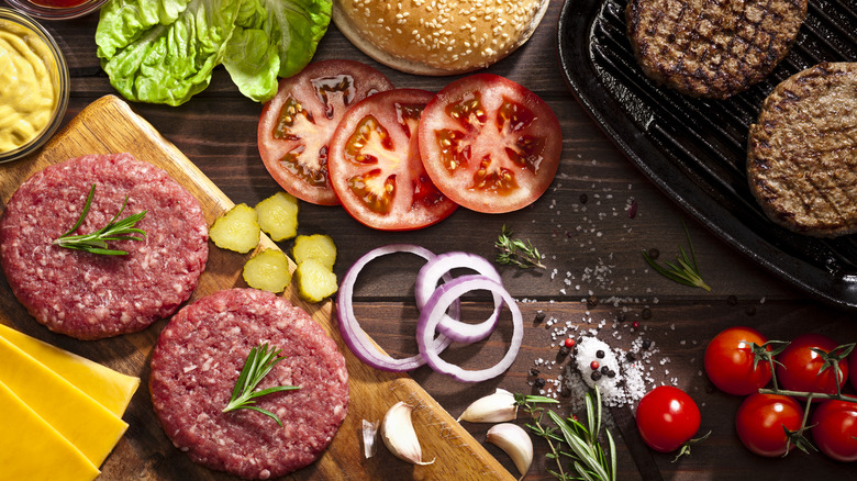 burger ingredients on wooden table