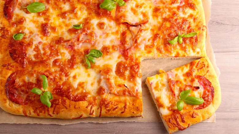 Homemade pizza on cutting board