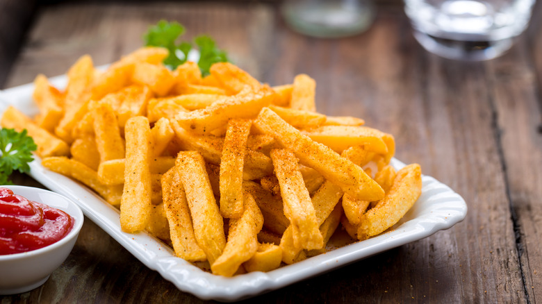 a plate of seasoned french fries