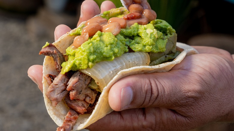 Steak taco in hand 