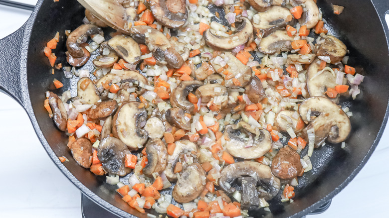 mushrooms, carrots, and onions in skillet