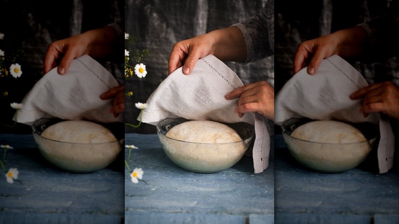 Covering dough with tea towel